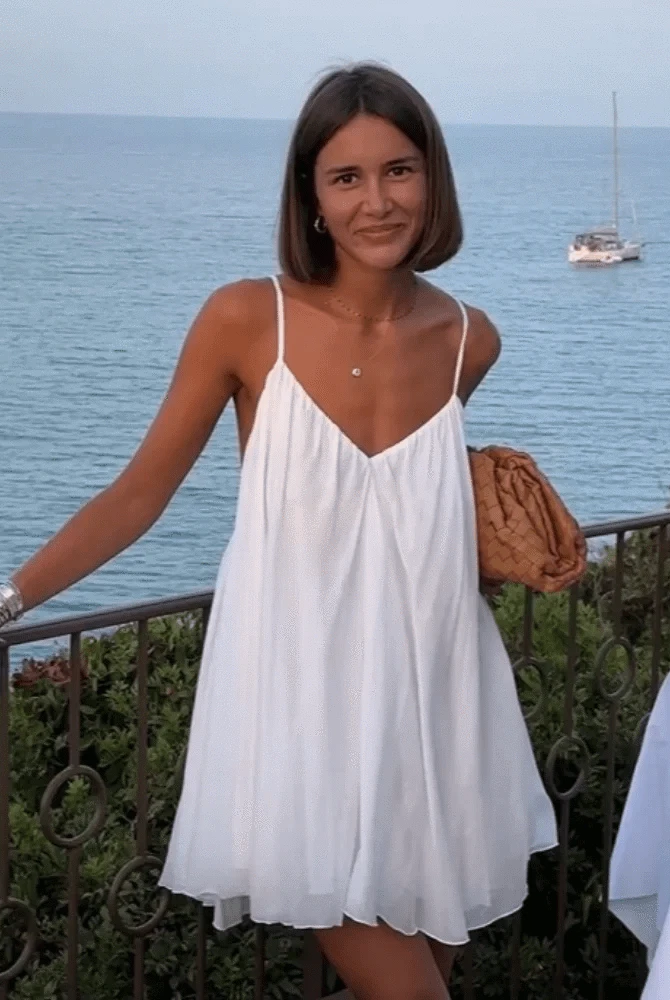 Elegant Lumina Wear Lena dress in a stylish design, shown in a medium size on a model with a fitted silhouette and intricate details.