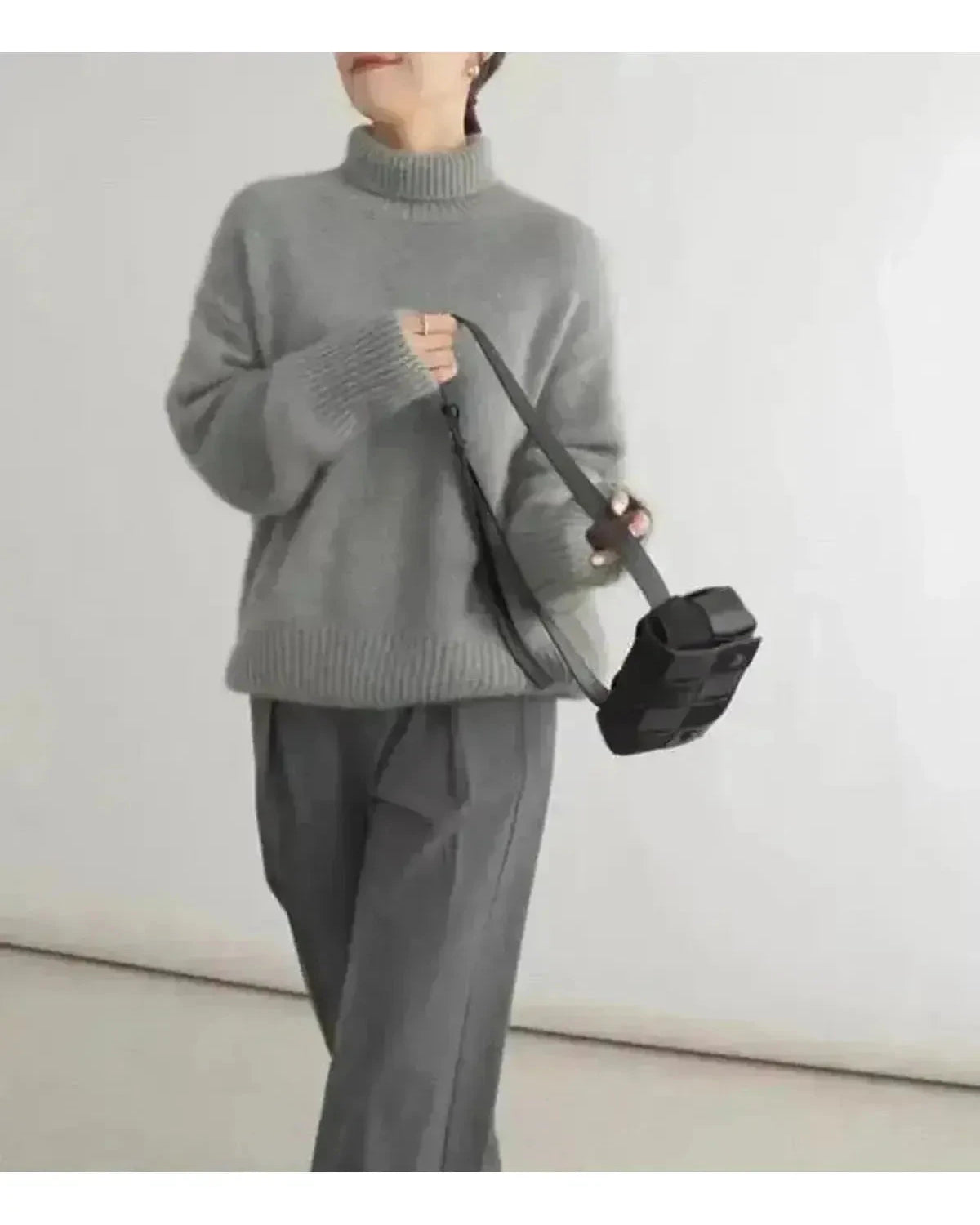 Beige Lena turtleneck sweater by Lumina Wear, close-up of knitted fabric and high neckline on a one-size sweater.