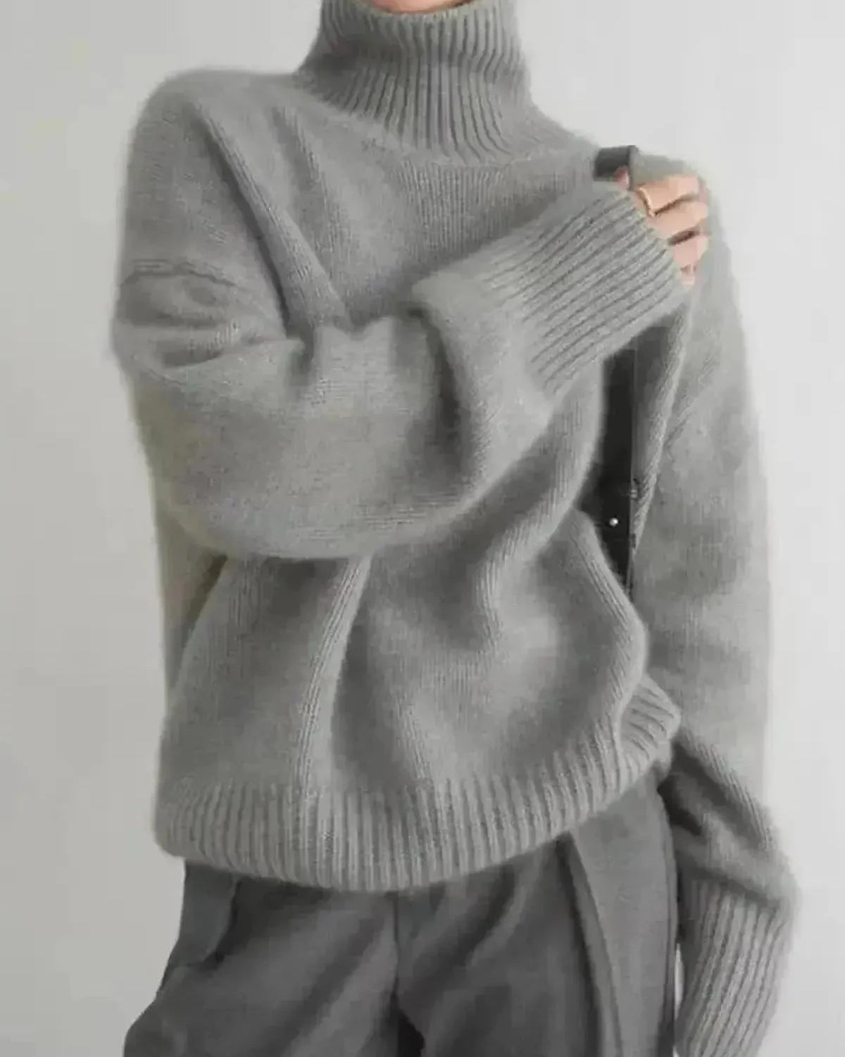 Beige Lena turtleneck sweater by Lumina Wear, featuring a cozy knit design and a relaxed fit, displayed on a neutral background.