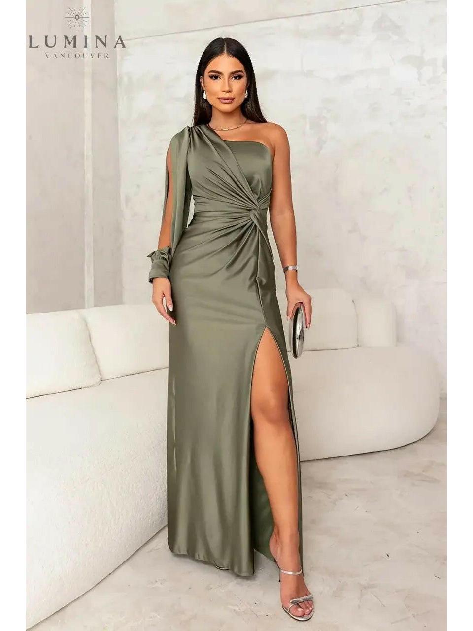 Blue-green Lenoir Elegant Dress by Lumina Wear, perfect for wedding guests, showcases a stylish, flowing design.