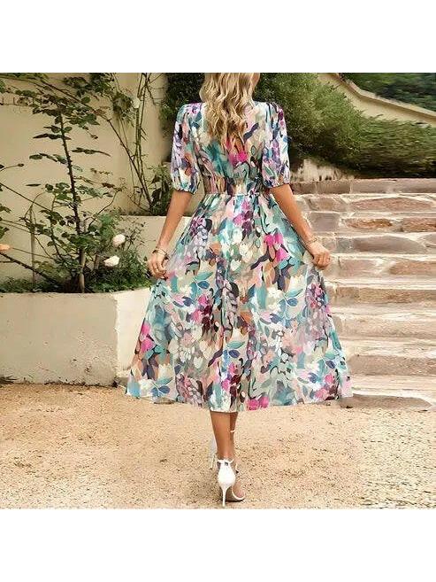 Blue Leona elegant midi dress by Lumina Vancouver, perfect for wedding guests, with flowing fabric and sophisticated design.