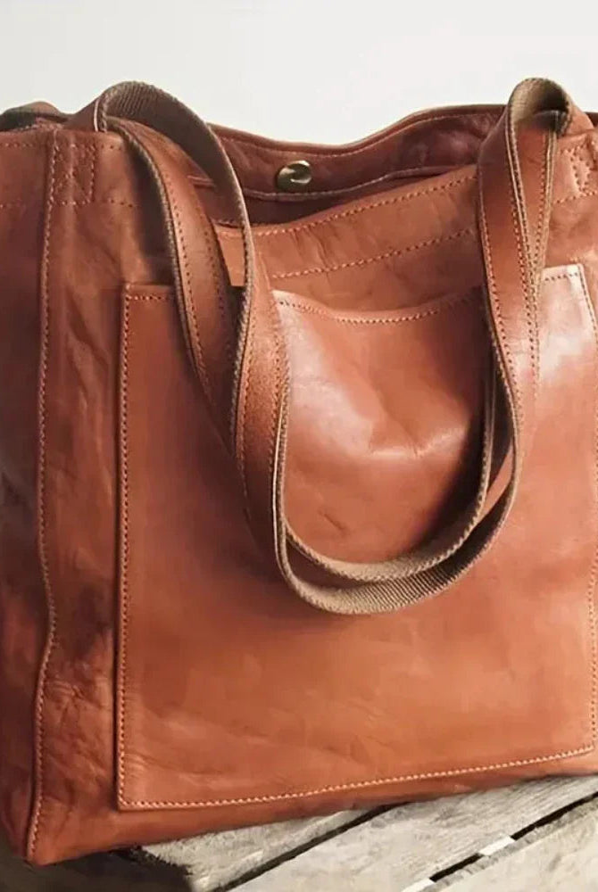 Lila Lumina Wear city bag in chestnut brown with smart storage, versatile elegant handbag for urban use.