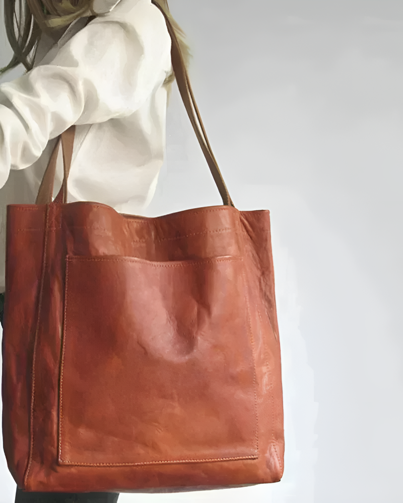 Lila Lumina handbag in chestnut brown featuring elegant versatile design with smart storage for city use.