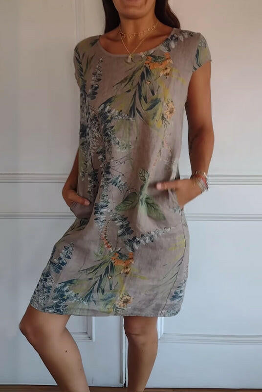 Lillian casual printed dress by Lumina Wear in white, featuring a relaxed fit and vibrant floral pattern, perfect for everyday wear.
