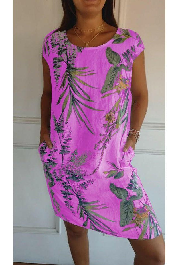 Lillian casual printed dress by Lumina Wear, white with floral patterns, displayed on a hanger against a neutral background.