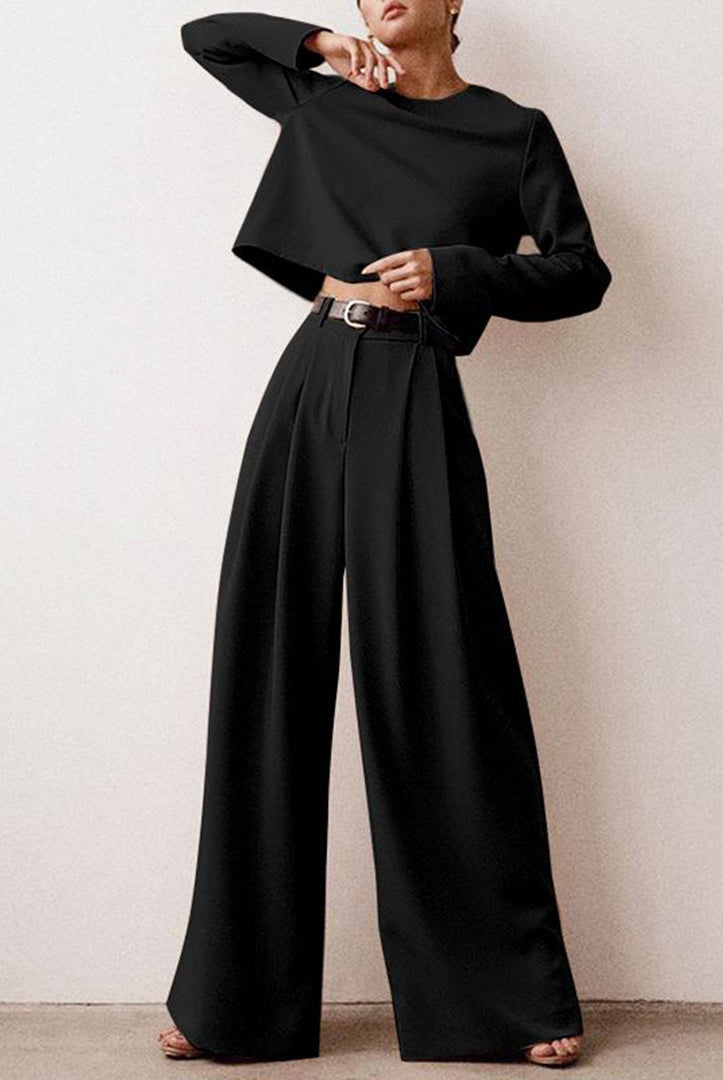 Black contemporary cropped top and wide-leg trousers set by Lumina Wear, stylish two-piece outfit for modern fashion.