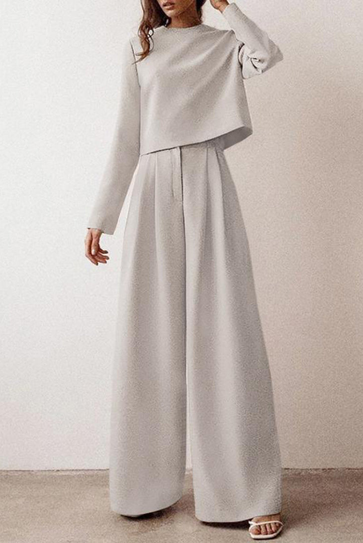 Black Lily two-piece set by Lumina Wear with a cropped top and wide-leg trousers, perfect for a modern, stylish look.
