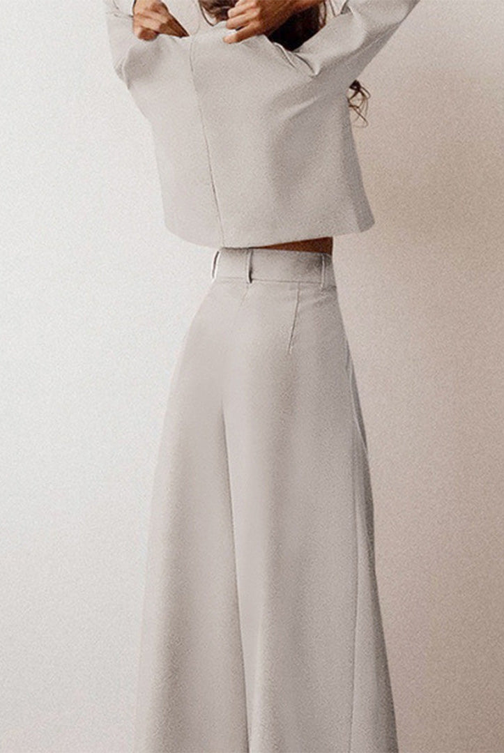 Black Lily two-piece set by Lumina Wear with a contemporary cropped top and wide-leg trousers, styled for modern elegance.