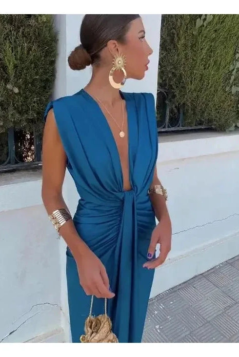 Elegant blue Vappu pleated evening dress by Lumina Wear, featuring a stylish design perfect for wedding guests.