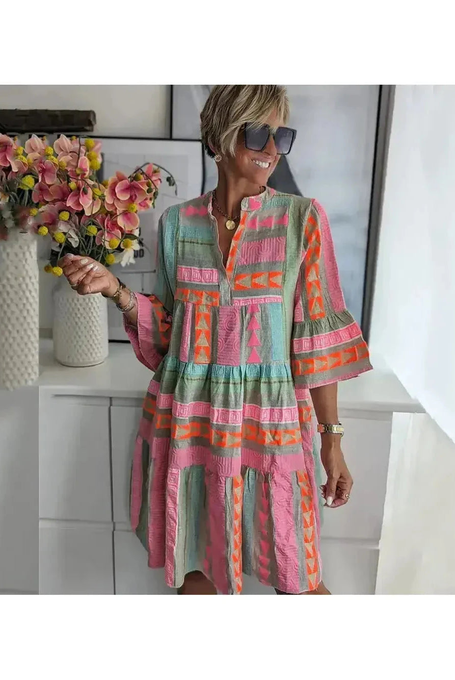 Lily spring dress by Lumina Wear featuring a floral pattern, lightweight fabric, and a flowing silhouette for warm-weather style.