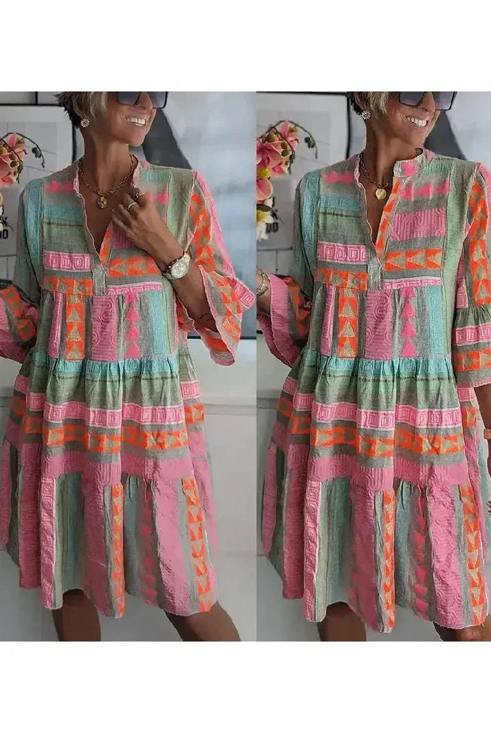Lumina Wear Tuulikki spring dress in light fabric with floral pattern, short sleeves, and a flattering fit for warm weather.