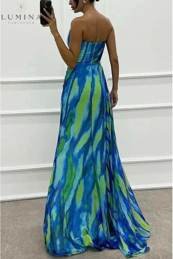 Blue off-shoulder printed maxi dress with slit by Lumina Wear, perfect for wedding guests, shown on a model.