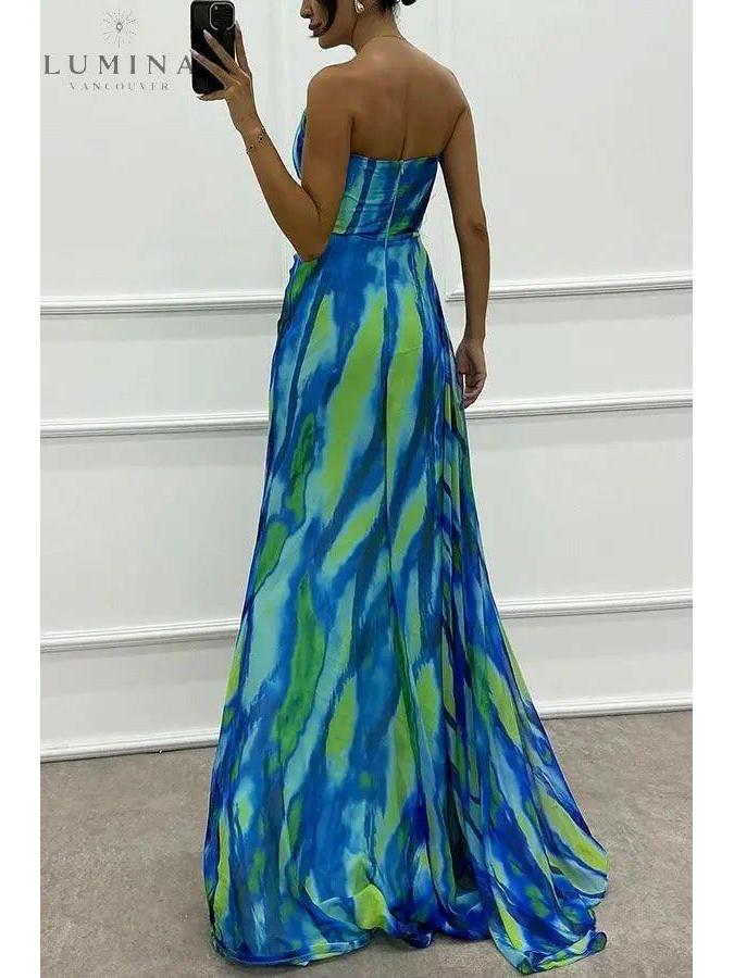 Blue Blanche off-shoulder slit printed maxi dress by Lumina Vancouver, perfect for wedding guests, shown on a model.