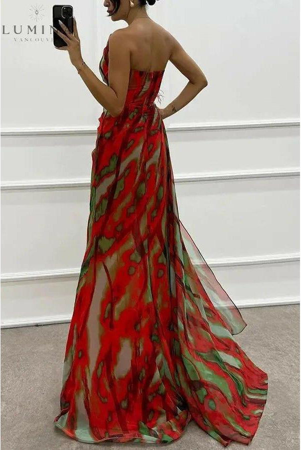 Blue Lumina Wear Blanche off-shoulder slit printed maxi dress with flowing fabric, perfect for wedding guests and elegant occasions.