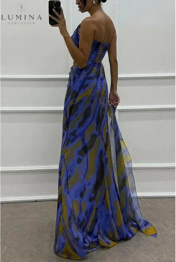 Blue Blanche off-shoulder slit printed maxi dress by Lumina Wear, perfect for wedding guests, with flowing fabric and elegant design.