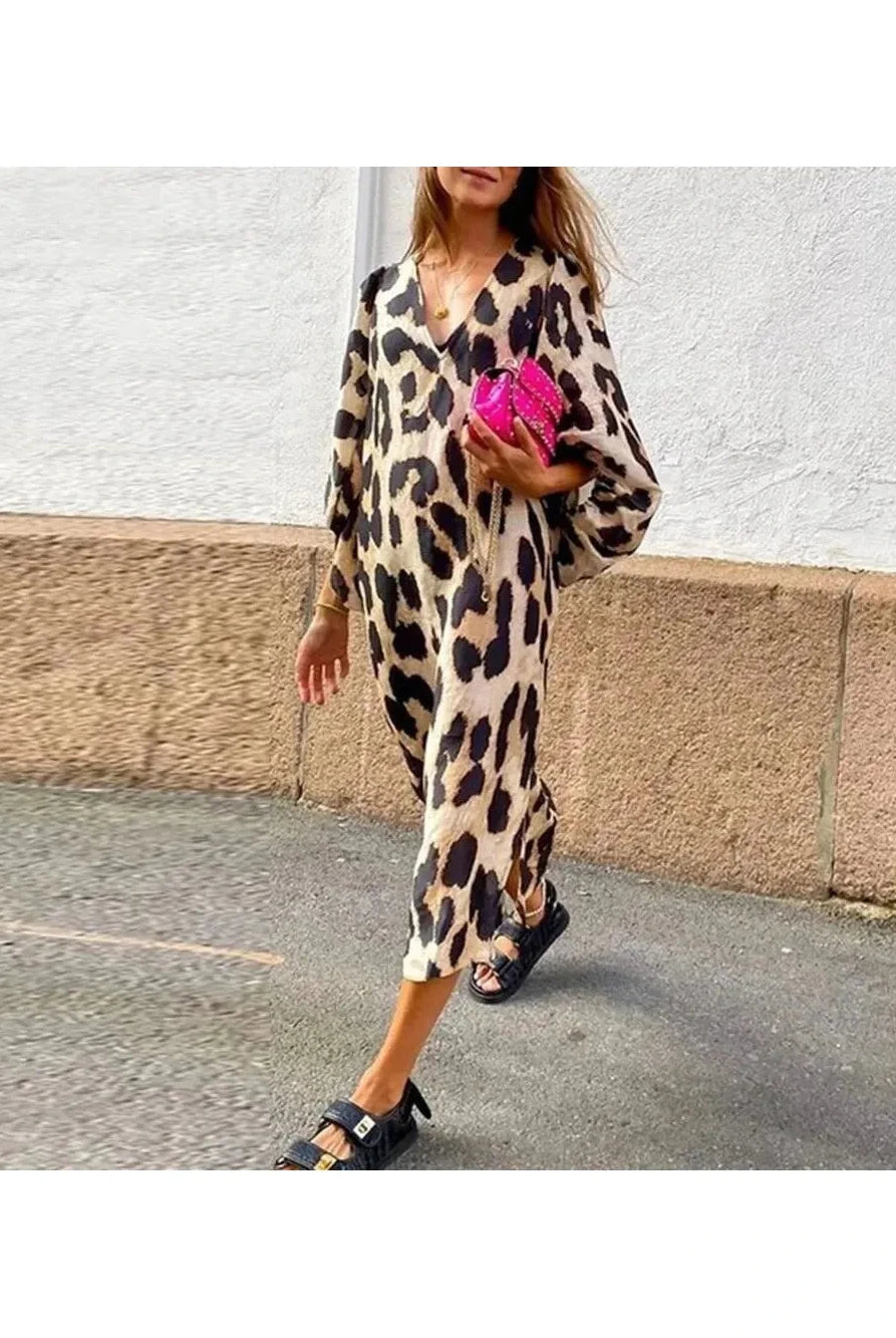 Lisa™ leopard print dress by Lumina Vancouver, showcasing a stylish, fitted dress with bold animal print and elegant design.