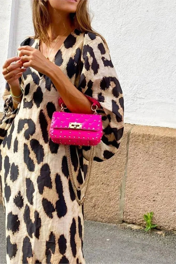 Lisa™ Leopard Print Dress by Lumina Vancouver, featuring a stylish leopard pattern and fitted silhouette on a model.