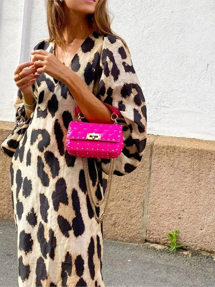 Lisa™ Leopard Print Dress by Lumina Vancouver, featuring a stylish leopard pattern and fitted silhouette on a model.
