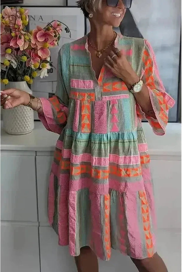Lissie spring dress by Lumina Wear featuring a floral pattern, lightweight fabric, and a flowy silhouette in vibrant colors.