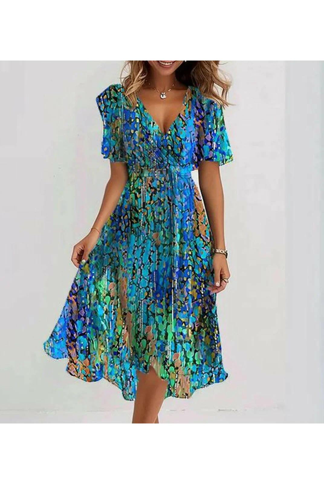 Lumina Wear Liza vibrant abstract midi dress in multicolored fabric, showcasing its stylish design and flowing silhouette.