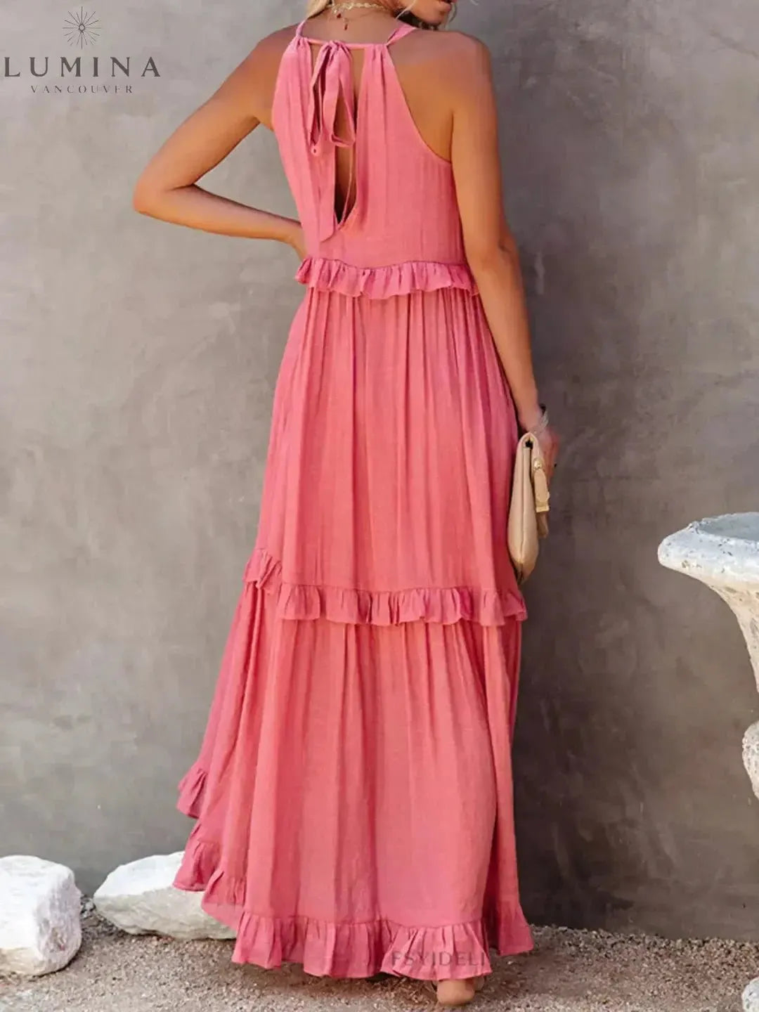 Apricot Lorena halterneck dress with ruffles and pockets, perfect for holiday vibes, by Lumina Wear.