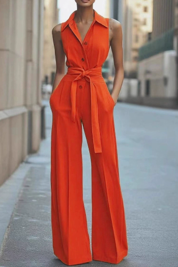 Orange sleeveless jumpsuit by Lumina Vancouver, model Lucienne, shown in XS size with a stylish, modern design.