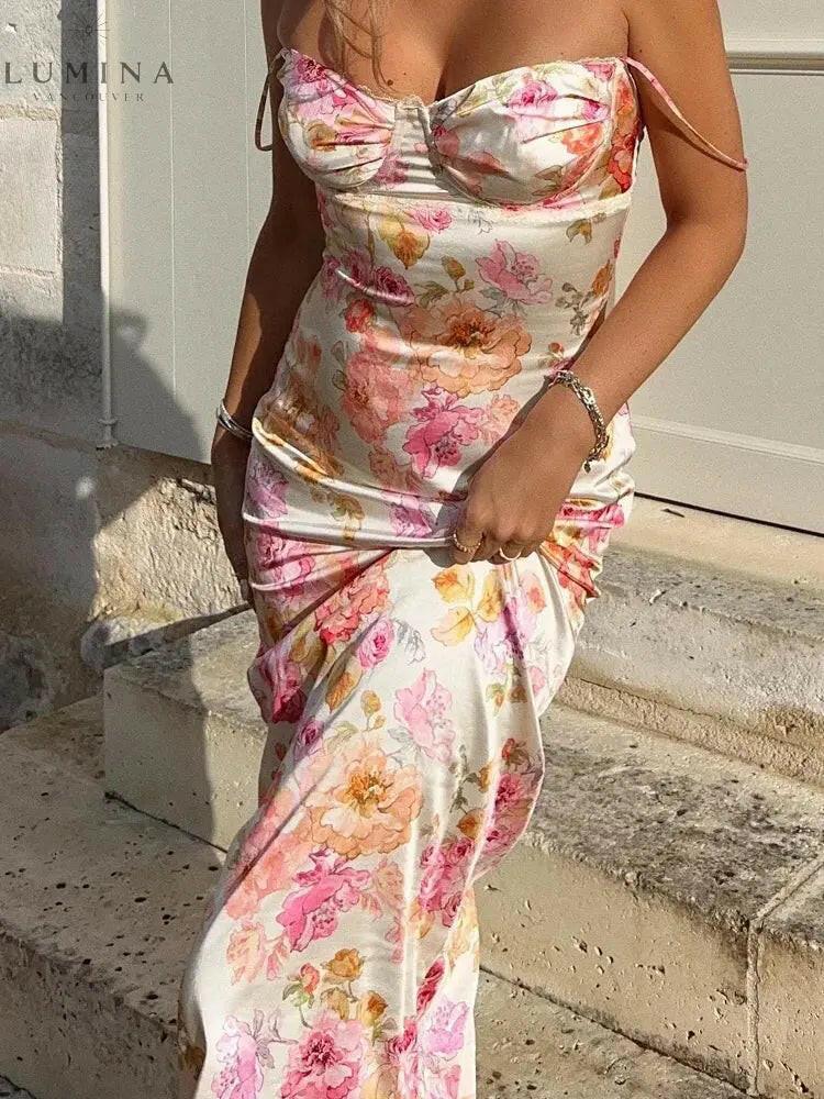 Lucy floral satin maxi dress by Lumina Vancouver, featuring a flowing silhouette and vibrant floral pattern.