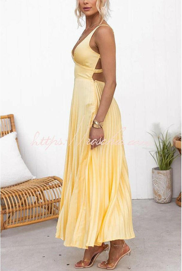 Yellow pleated dress named Lucy by Lumina Vancouver, featuring elegant fabric and a stylish design for sophisticated occasions.