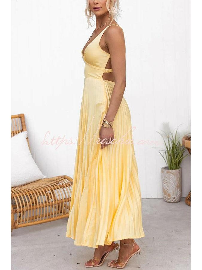 Yellow pleated dress named Lucy by Lumina Vancouver, featuring elegant fabric and a stylish design for sophisticated occasions.