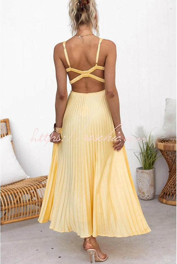 Yellow Lucy pleated dress by Lumina Vancouver, showcasing its elegant fabric and stylish design.