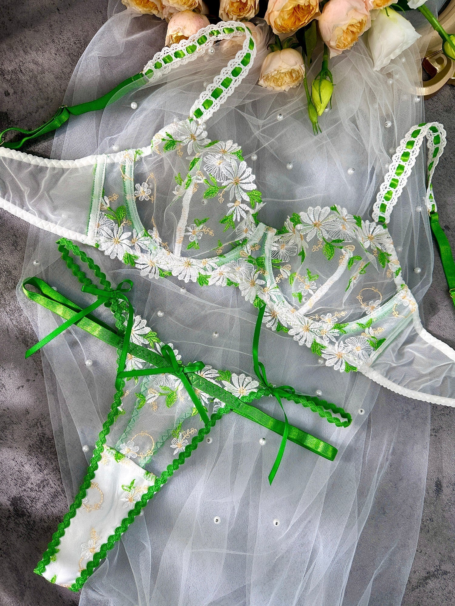 White Lovely Daisy lace lingerie set by Lumina Vancouver featuring a bra and matching panties on a flat lay.