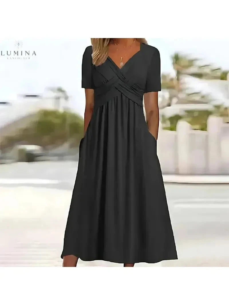 Green Leila elegant dress by Lumina Vancouver with tummy coverage, featuring a stylish and sophisticated design.