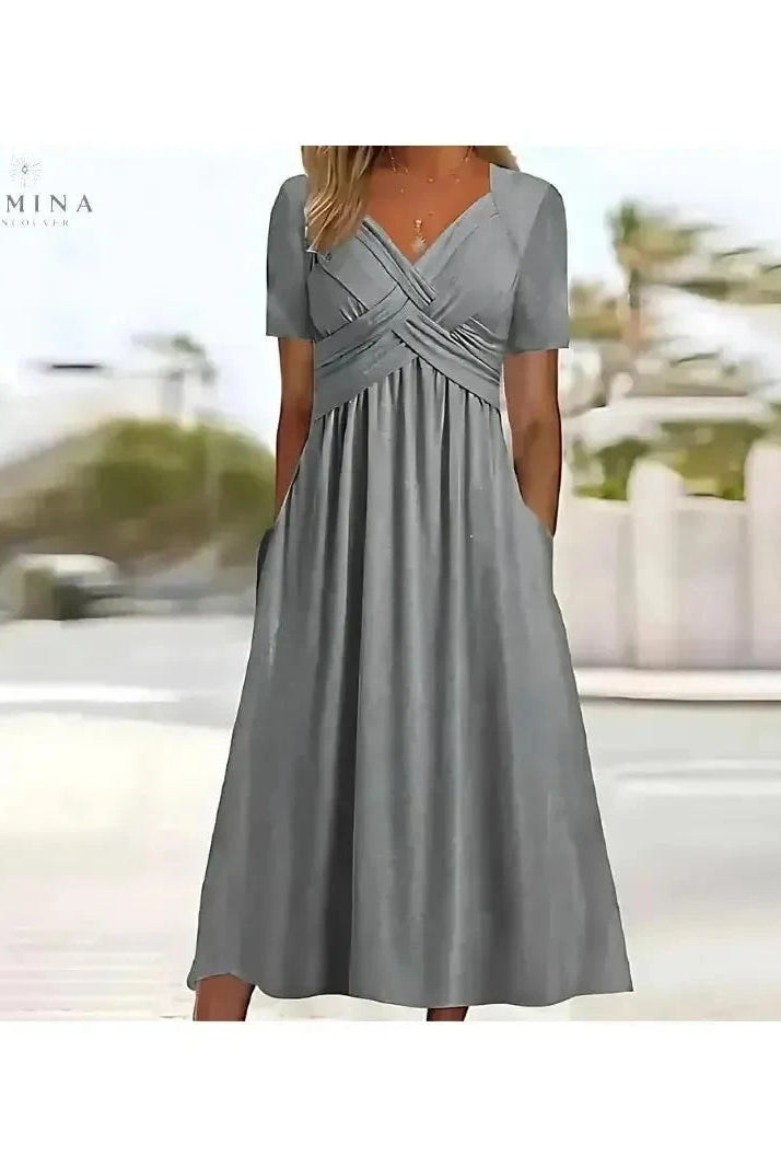 Lumina Wear Leila elegant green dress with tummy coverage, stylish design, and comfortable fit for special occasions.