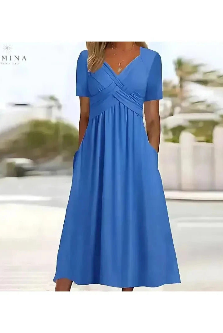 Lumina Wear Leila elegant green dress with tummy coverage, featuring a stylish design and fitted silhouette for formal occasions.