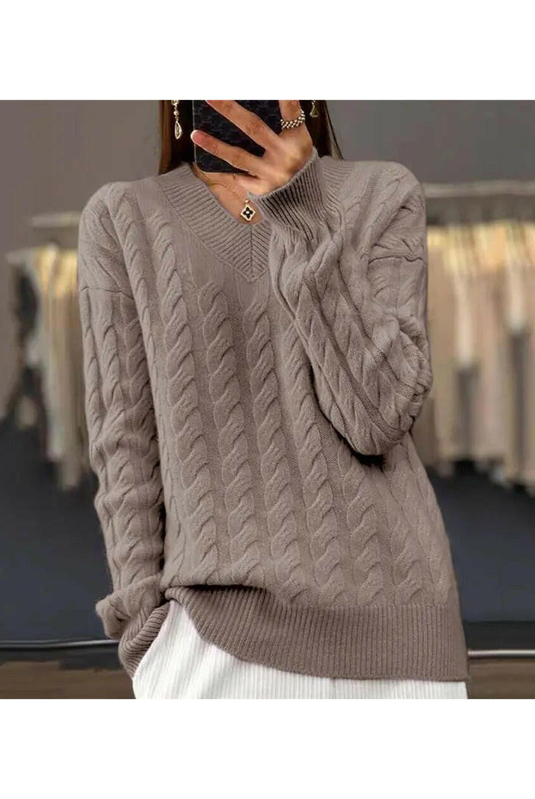 Lumina Wear Rona Cable Knit Sweater in apricot color, showing the cozy textured knit design on a model.