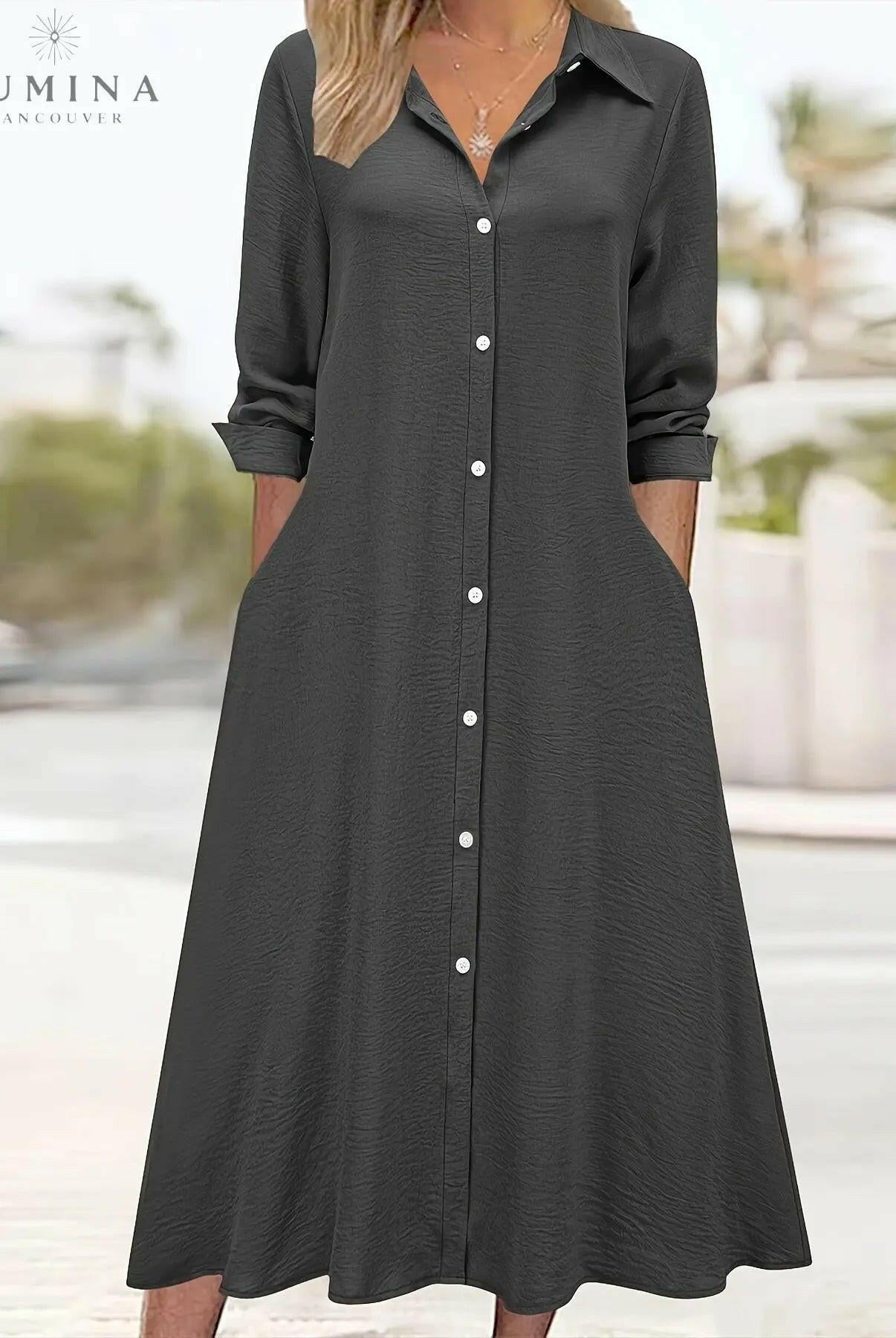 Black Charlotte button front shirt dress by Lumina Vancouver, featuring a classic collar and long sleeves, displayed on a mannequin.