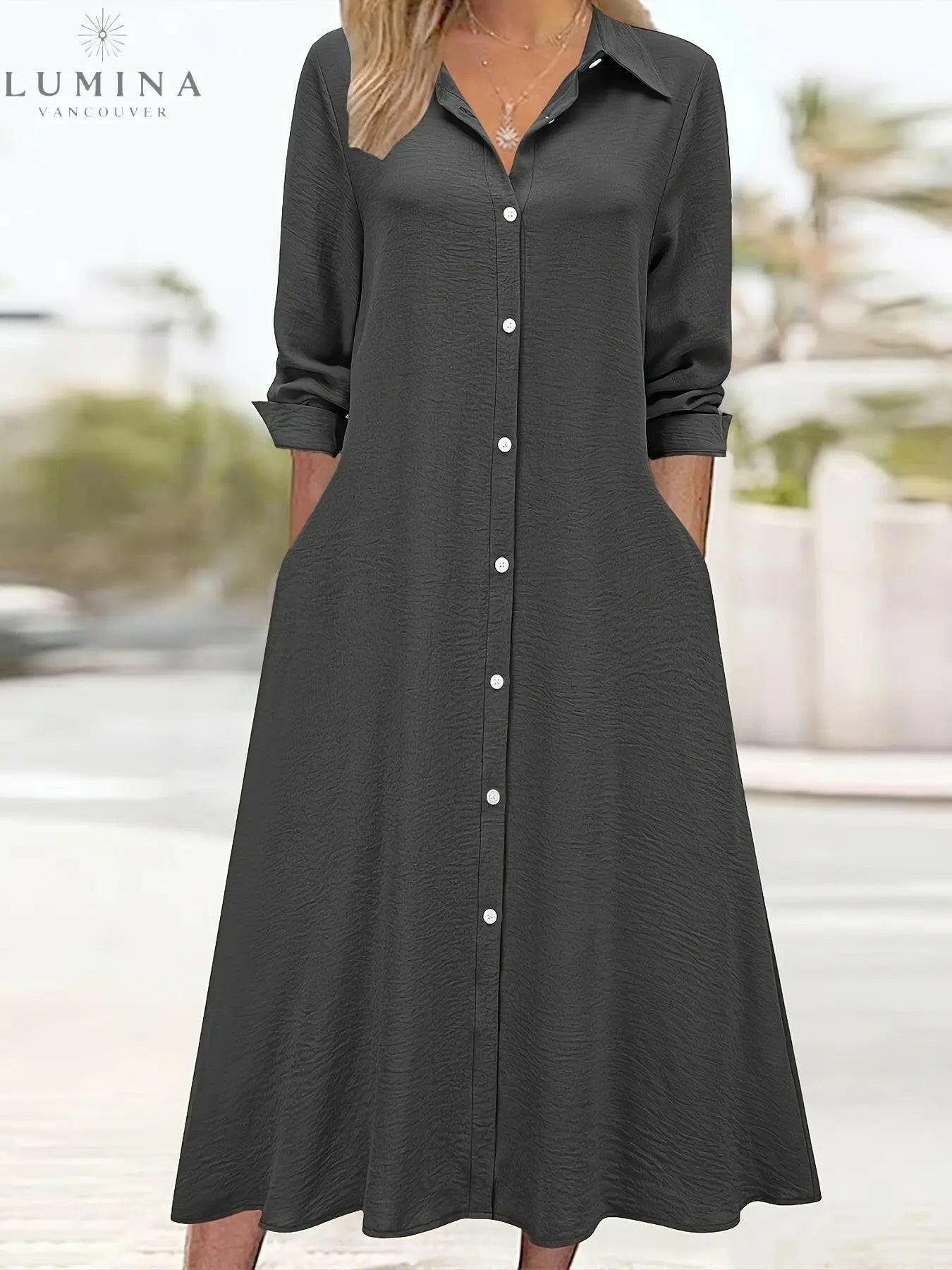 Black Charlotte button front shirt dress by Lumina Vancouver, featuring a classic collar and long sleeves, displayed on a mannequin.