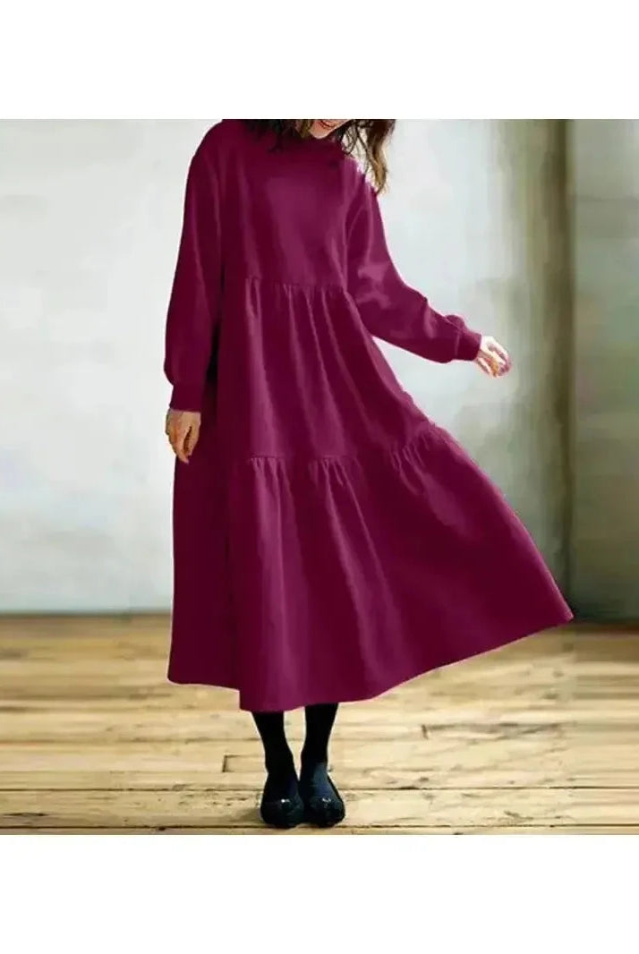 Black long-sleeved hoodie dress from Lumina Wear's Isabella collection, featuring a comfortable fit and casual style.