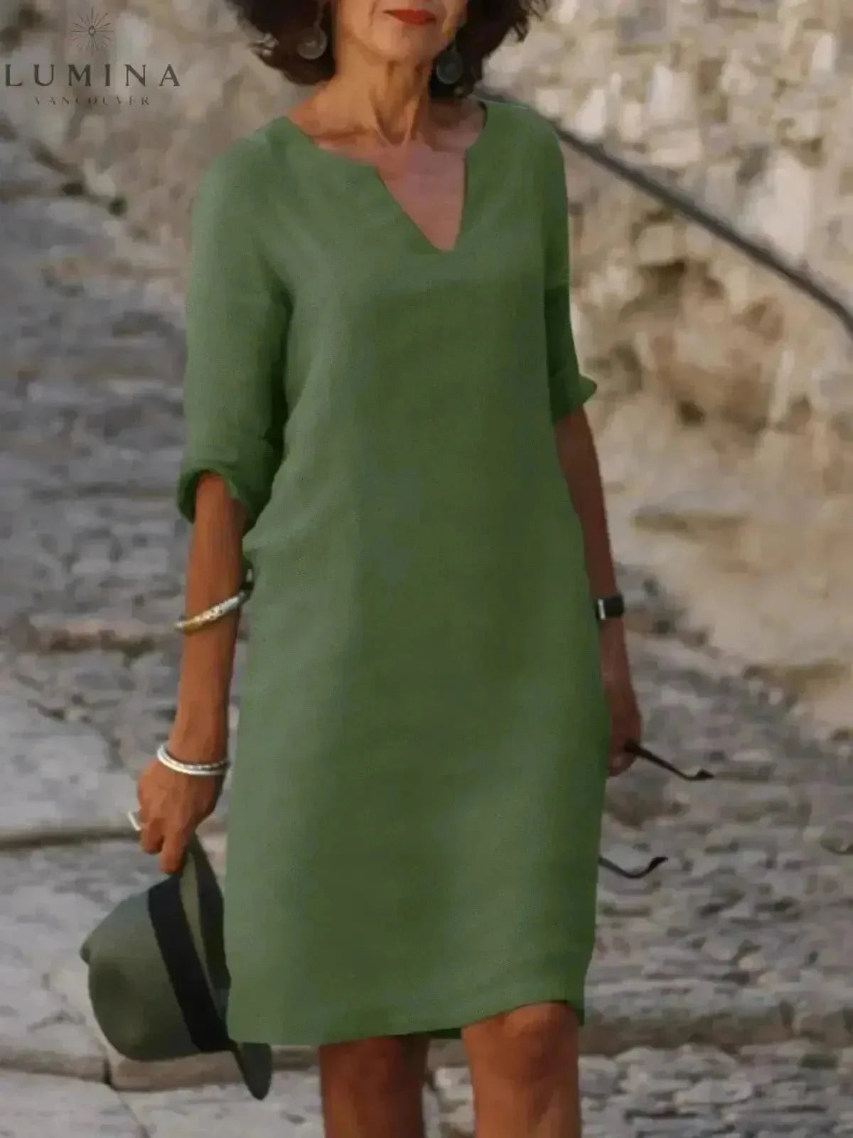 Black Lumina Vancouver Suzan elegant dress with V-neckline, featuring a stylish and sophisticated design for formal occasions.