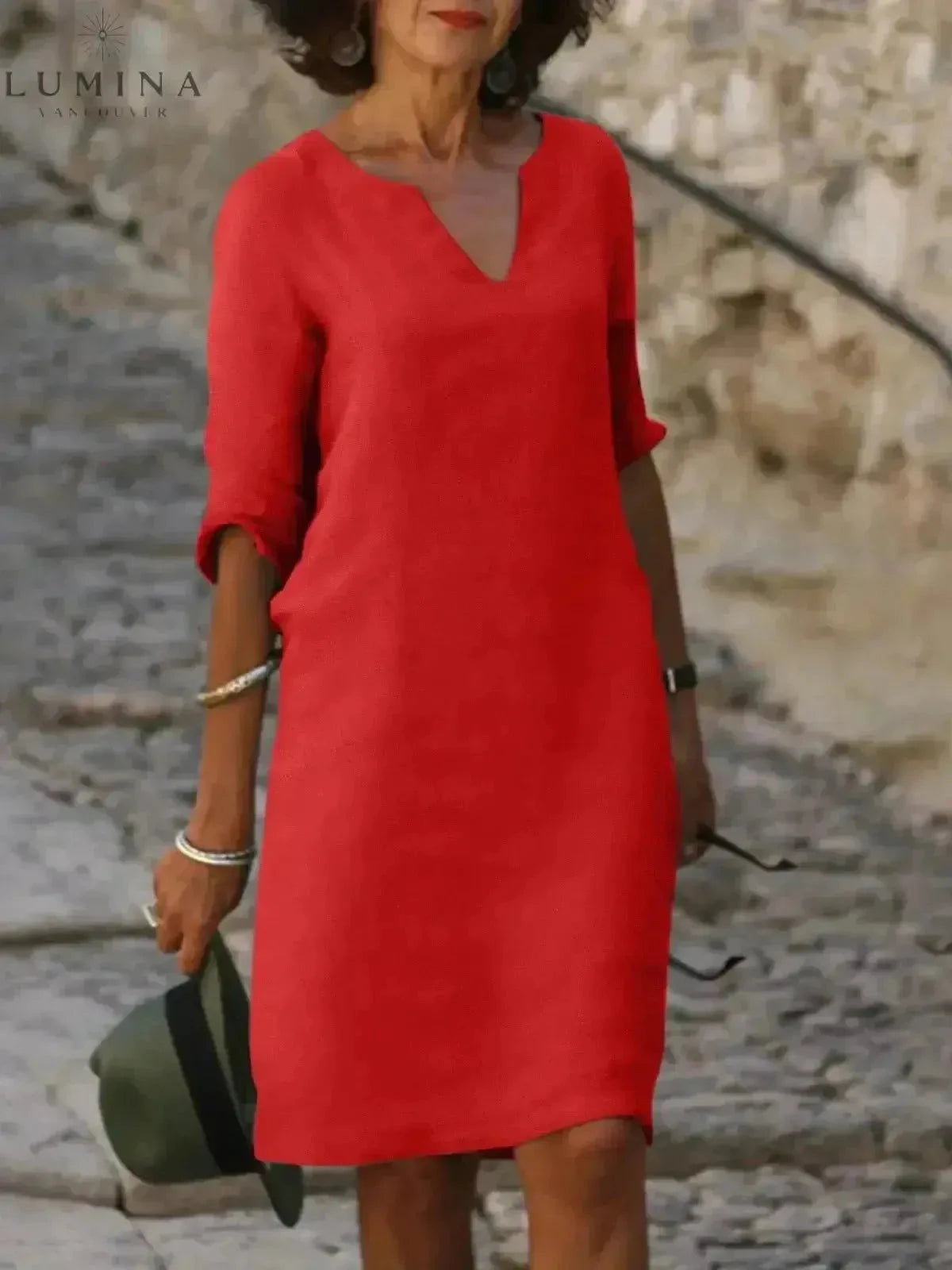 Black Lumina Vancouver Suzan elegant dress with V-neckline, flowing fabric and stylish design for formal occasions