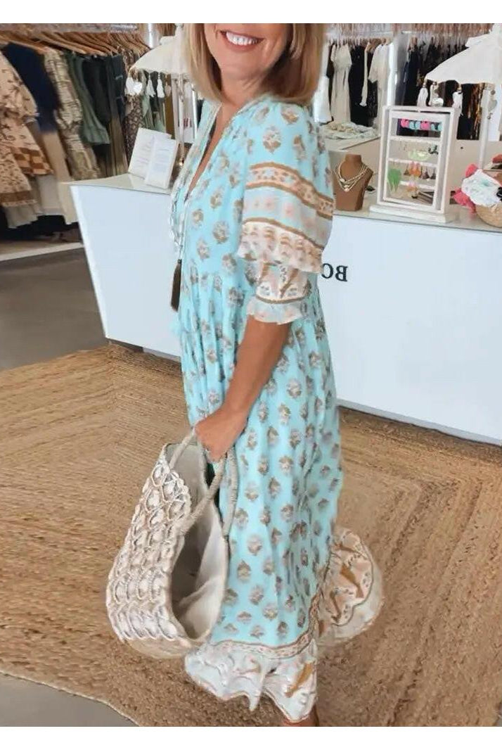 Lumina Wear Estrella casual half-sleeve blue maxi dress displayed on a model, flowing fabric and relaxed fit.