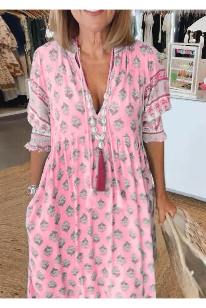Lumina Wear Estrella casual blue half-sleeve maxi dress displayed on a hanger, showcasing its flowing fabric and relaxed fit.