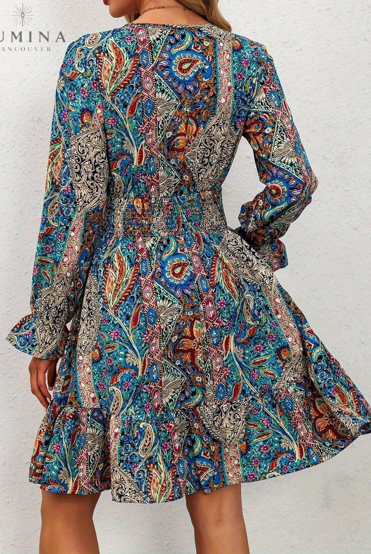 Blue boho elegance dress by Lumina Wear featuring flowing fabric and intricate details, perfect for stylish occasions.