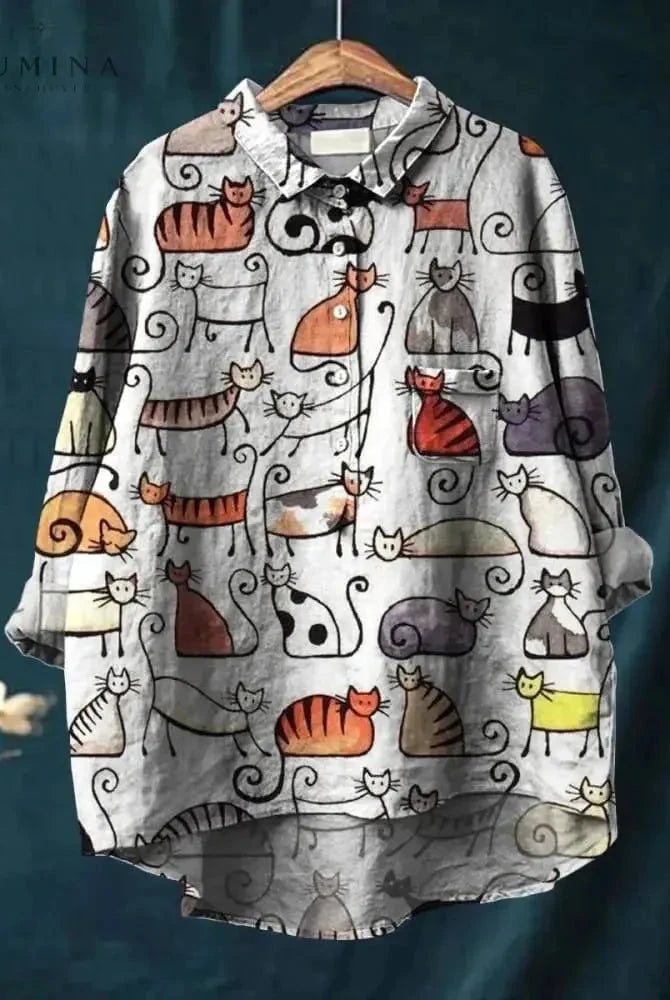 Lumina Wear Ula cat art T-shirt featuring a colorful cat illustration on a soft fabric tee.