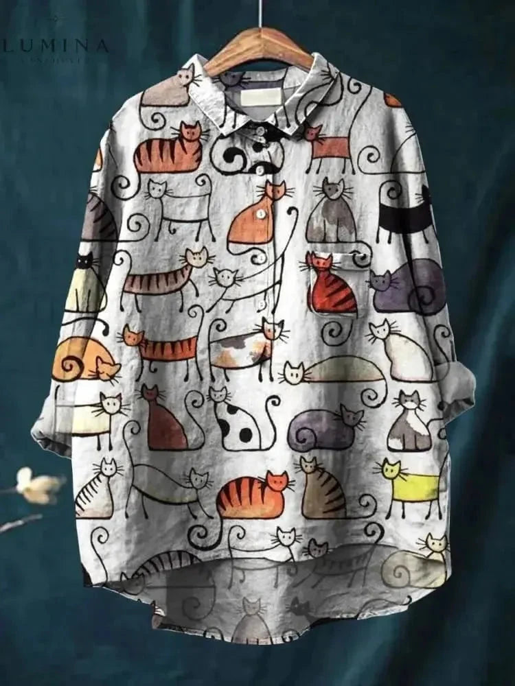 Lumina Wear Ula cat art T-shirt featuring a colorful cat illustration on a soft fabric tee.