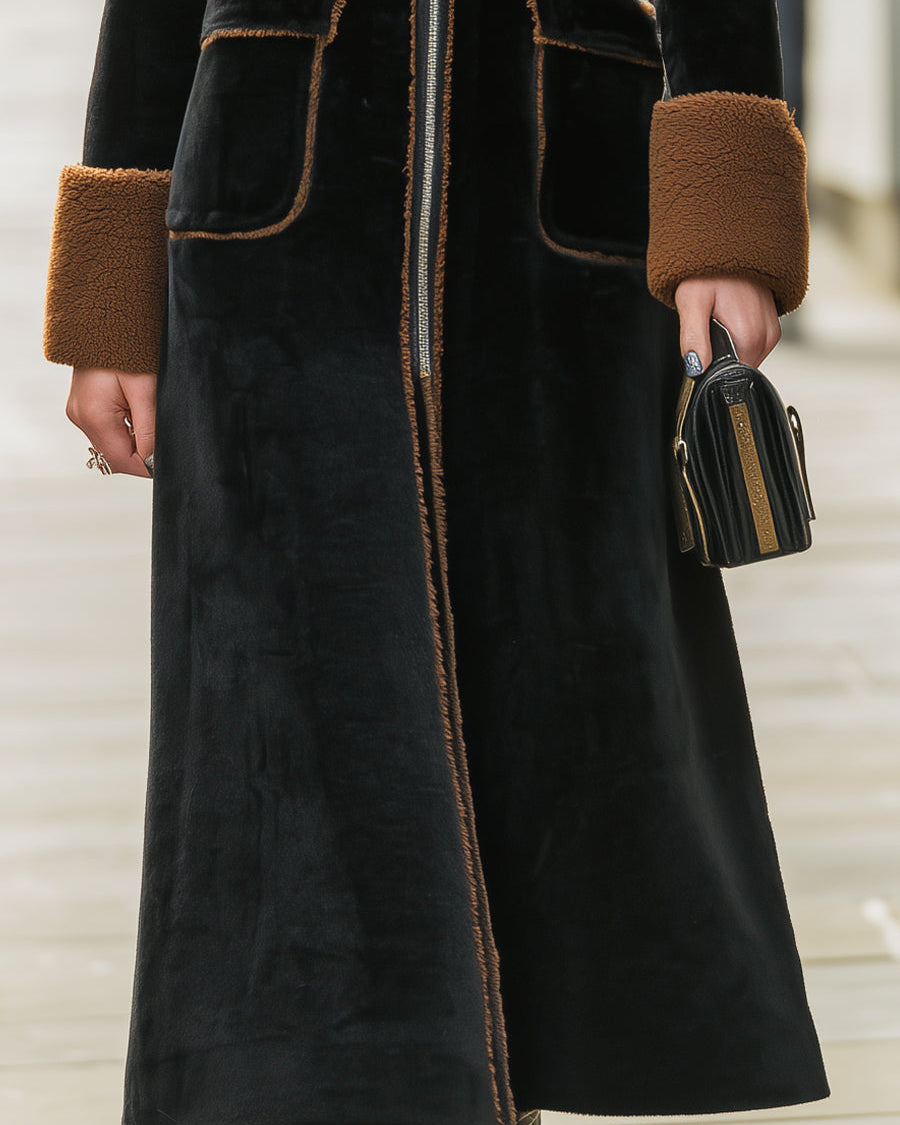 Black Lumina Wear Beatrix long plush coat with elegant contrast trim, showing the cozy, stylish coat on a model.