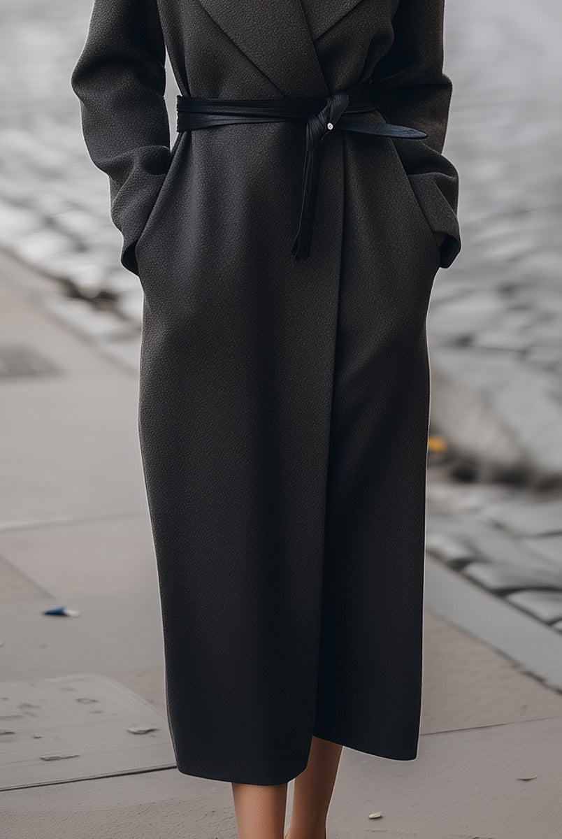 Charcoal Petronella Lumina Vancouver wrap coat with belt, shown on model, highlighting its stylish design and cozy fit.