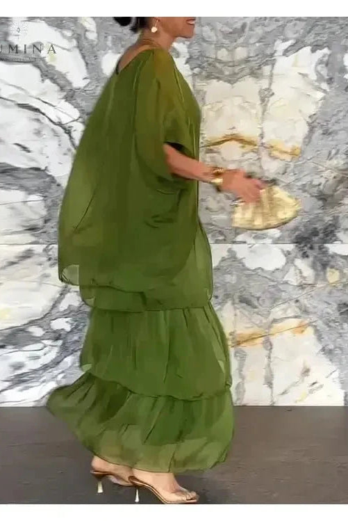 Dark green Caroline loose round neck dress by Lumina Vancouver, shown on a model with a relaxed fit and simple design.