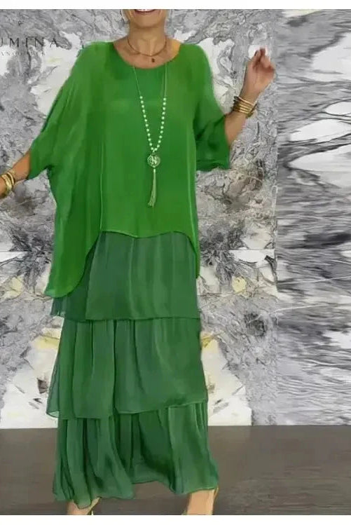 Dark green Caroline loose round-neck dress by Lumina Vancouver, shown on a model, featuring a relaxed fit and casual style.