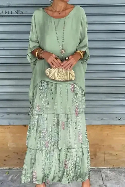 Dark green Caroline loose round neck dress by Lumina Vancouver, shown on a model with a relaxed fit and simple style.